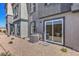 Contemporary home featuring stucco siding, gray trim, a sliding glass door, and low-maintenance desert landscaping at 2514 Petunia Garden Ave # 226, North Las Vegas, NV 89081