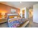 Comfortable bedroom with patterned bedding, side tables, and a walk-in closet at 2514 Petunia Garden Ave # 226, North Las Vegas, NV 89081