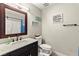 Cozy bathroom features a stylish vanity and marble countertop, complemented by a modern mirror and decor at 2569 Paradise Village Way, Las Vegas, NV 89120