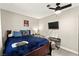 Bedroom features a comfortable bed, ceiling fan, and mounted TV for leisure at 2569 Paradise Village Way, Las Vegas, NV 89120