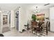 Cozy dining area with wooden table and chairs, complemented by stylish decor at 2569 Paradise Village Way, Las Vegas, NV 89120
