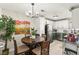Bright dining area open to the kitchen with stainless steel appliances and modern finishes at 2569 Paradise Village Way, Las Vegas, NV 89120