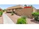 Charming single-story exterior with desert landscaping and private courtyard at 2569 Paradise Village Way, Las Vegas, NV 89120