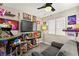 Vibrant game room features an arcade machine, multiple screens, and a cozy seating area at 2569 Paradise Village Way, Las Vegas, NV 89120