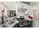 Well-lit kitchen featuring stainless steel appliances, granite countertops, and ample cabinet space at 2569 Paradise Village Way, Las Vegas, NV 89120
