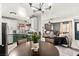 Open-concept living and kitchen area, featuring a modern design and comfortable seating at 2569 Paradise Village Way, Las Vegas, NV 89120