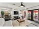 Comfortable living room with patio access, open to dining and kitchen at 2569 Paradise Village Way, Las Vegas, NV 89120