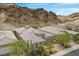 Overhead view of a desert community home, highlighting tile roof and mountain views at 26 Costa Tropical Dr, Henderson, NV 89011