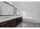 A bathroom features a large vanity with double sinks, a shower and a tub at 26 Costa Tropical Dr, Henderson, NV 89011