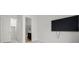 Spacious bedroom with a wall-mounted TV and ensuite bath and closet at 26 Costa Tropical Dr, Henderson, NV 89011