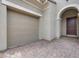 Elegant home featuring a neutral color palette, arched entryway, and two car garage at 26 Costa Tropical Dr, Henderson, NV 89011