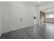 Bright foyer with wood-look floors and a large white front door at 26 Costa Tropical Dr, Henderson, NV 89011