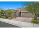 Charming single-story home with a well-maintained front yard and a two-car garage at 26 Costa Tropical Dr, Henderson, NV 89011