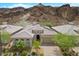 A well-maintained desert home with a tile roof and mature landscaping at 26 Costa Tropical Dr, Henderson, NV 89011