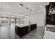 Large, open space with quartz countertops, dark wood cabinets, and stainless steel appliances at 26 Costa Tropical Dr, Henderson, NV 89011