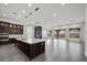 Spacious open kitchen with stone fireplace, large island, and modern appliances at 26 Costa Tropical Dr, Henderson, NV 89011