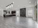 Bright open-concept living space seamlessly connects to a gourmet kitchen, complete with modern fireplace feature at 26 Costa Tropical Dr, Henderson, NV 89011