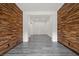 Room showcases unique wood paneled walls and modern gray flooring creating a warm, inviting ambiance at 26 Costa Tropical Dr, Henderson, NV 89011