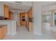 Open kitchen with wood cabinets, stone counters, and stainless appliances at 2747 Paradise Rd # 2305, Las Vegas, NV 89109