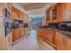 Modern kitchen featuring wooden cabinets and black countertops at 2747 Paradise Rd # 2305, Las Vegas, NV 89109
