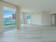 Spacious living room with hardwood floors and floor to ceiling windows at 2747 Paradise Rd # 2305, Las Vegas, NV 89109
