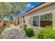Beautiful backyard featuring lush landscaping and a paved patio at 2808 Cygnus St, Las Vegas, NV 89117