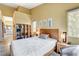 Bright bedroom featuring art and natural light from the windows and ensuite bathroom at 2808 Cygnus St, Las Vegas, NV 89117