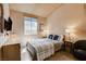 Cozy bedroom with vaulted ceiling, natural light, and TV on the wall at 2808 Cygnus St, Las Vegas, NV 89117