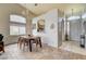 Open dining area featuring a wooden table, modern chairs, and views to the outside at 2808 Cygnus St, Las Vegas, NV 89117