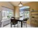 Cozy dining area featuring a stylish table set and bright windows with views to the outside at 2808 Cygnus St, Las Vegas, NV 89117