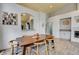 Open dining area featuring a wooden table, modern chairs, and an open view into the kitchen at 2808 Cygnus St, Las Vegas, NV 89117