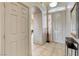 Welcoming home entry features tile flooring, neutral paint, and a decorative glass window for added light at 2808 Cygnus St, Las Vegas, NV 89117