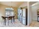 Modern eat-in kitchen featuring stainless steel appliances, sage cabinets, and ample storage at 2808 Cygnus St, Las Vegas, NV 89117