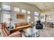 Bright living room features high ceilings, natural light, and comfortable leather seating at 2808 Cygnus St, Las Vegas, NV 89117