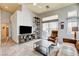 Spacious living area with tile floors, media center, and access to outdoor area at 2808 Cygnus St, Las Vegas, NV 89117