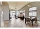 Open living room with vaulted ceilings, neutral tones, and a combination living and dining area at 2808 Cygnus St, Las Vegas, NV 89117