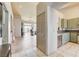 Open-concept living space with tile flooring, neutral paint, and sliding doors to the backyard at 2808 Cygnus St, Las Vegas, NV 89117