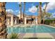 Beautiful community pool area with lounge chairs, cabana, and palm trees at 2808 Cygnus St, Las Vegas, NV 89117