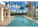 Inviting community pool with lounge chairs and lush landscaping at 2808 Cygnus St, Las Vegas, NV 89117