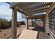 Backyard featuring a covered patio area, desert landscaping, and privacy wall at 2839 Kensington St, Las Vegas, NV 89156