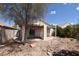 Landscaped backyard featuring desert landscaping, decorative rock, and a covered patio at 2839 Kensington St, Las Vegas, NV 89156