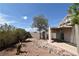 A serene backyard featuring a covered patio and low-maintenance landscaping. Enjoy outdoor living! at 2839 Kensington St, Las Vegas, NV 89156