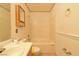 Cozy bathroom showcasing a tub with shower, toilet, and vanity with ample cabinet space at 2839 Kensington St, Las Vegas, NV 89156