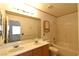 Bathroom featuring double sinks, framed mirror, toilet, tub, and shower combination at 2839 Kensington St, Las Vegas, NV 89156