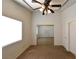 Spacious carpeted bedroom with decorative trim, natural light, and a closet with mirrored doors at 2839 Kensington St, Las Vegas, NV 89156