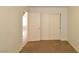 Bedroom featuring neutral walls, carpet flooring, and closet access at 2839 Kensington St, Las Vegas, NV 89156
