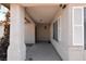 Covered entryway featuring exterior lighting and shutters on windows at 2839 Kensington St, Las Vegas, NV 89156