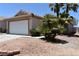 Inviting single-story home with a two-car garage, neutral paint, and low-maintenance landscaping at 2839 Kensington St, Las Vegas, NV 89156