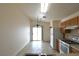 Functional kitchen featuring white appliances and a sliding door to the backyard at 2839 Kensington St, Las Vegas, NV 89156