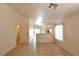 Open living room featuring tile floors and a partial wall dividing the kitchen at 2839 Kensington St, Las Vegas, NV 89156
